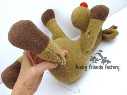 Sew up arms and legs of reindeer